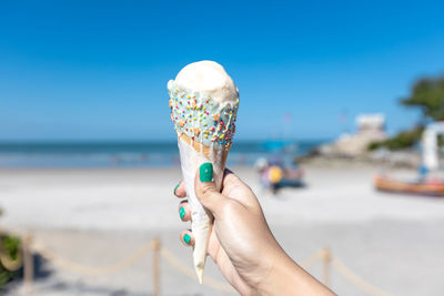 Midsection of person holding ice cream