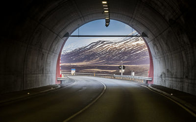 Snowcapped mountain view inside road tunnel in iceland