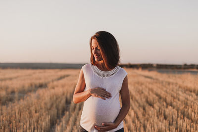 Woman standing in field