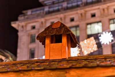 Low angle view of illuminated building against sky at night