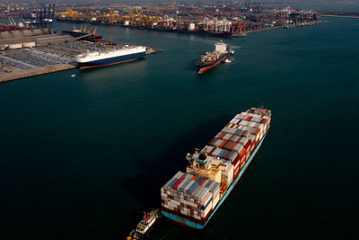 Aerial view container cargo ship carrying commercial container in import export business 