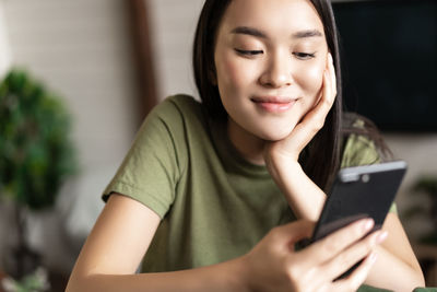 Young woman using mobile phone