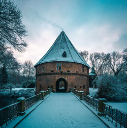 Walkway by building against sky during winter, schloss bladenhorts