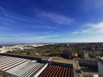 High angle view of townscape against blue sky