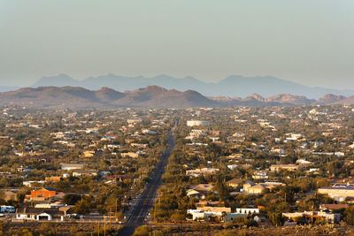 Aerial view of cityscape against clear sky