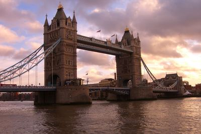 View of towerbridge over river against cloudy sky