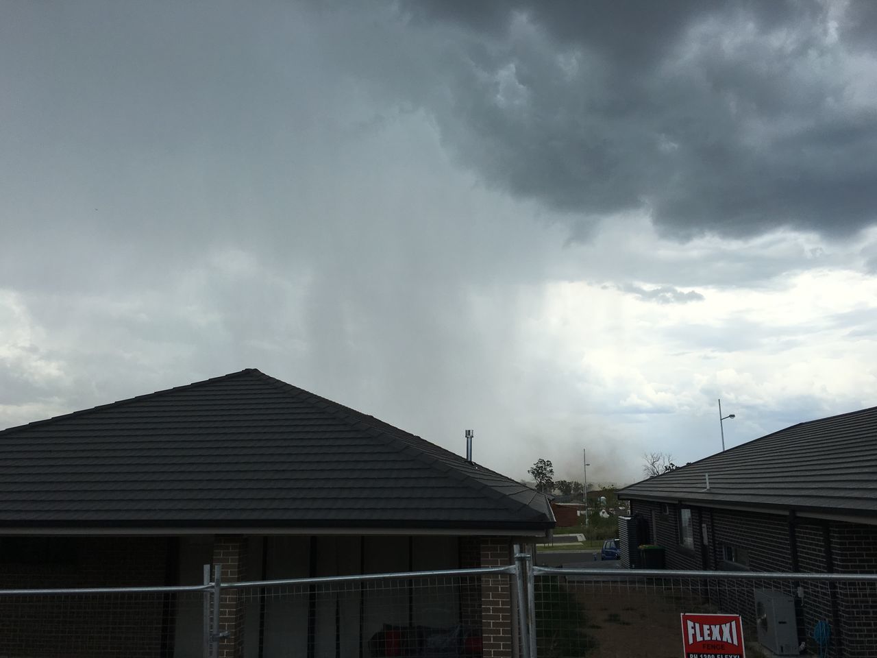 building exterior, sky, architecture, built structure, cloud - sky, cloudy, low angle view, cloud, overcast, weather, house, outdoors, building, city, storm cloud, roof, no people, high section, day, residential building