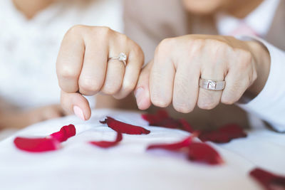 Close-up of woman hands on table