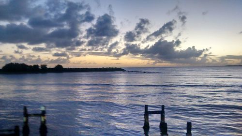 Scenic view of sea at sunset