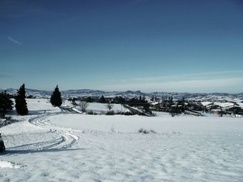 Scenic view of snow covered field