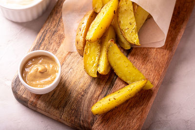 Delicious slices of baked potatoes with rosemary and oil