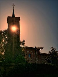 Low angle view of building against sky during sunset