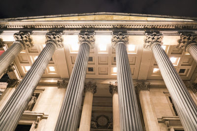 Low angle view of illuminated building at night