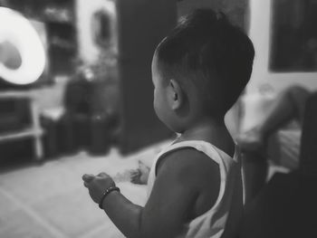 Side view of cute baby at home