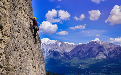 Man climbing mountain in canada