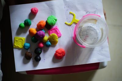 High angle view of multi colored candies on table