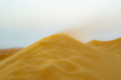 Scenic view of desert against clear sky