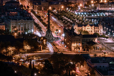 High angle view of city lit up at night