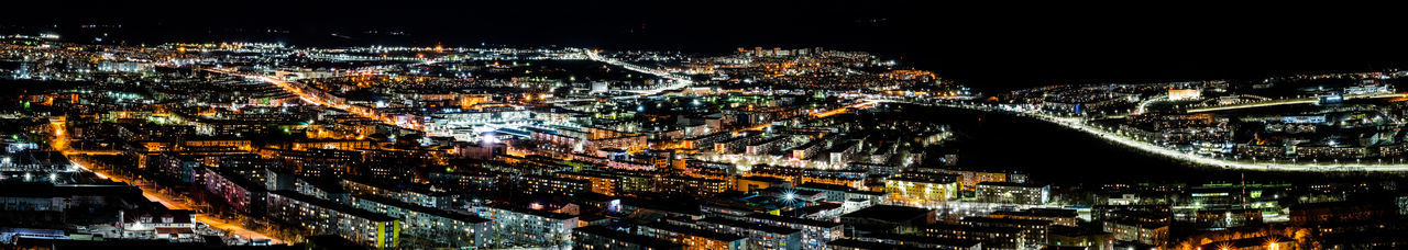 Aerial view of illuminated town at night
