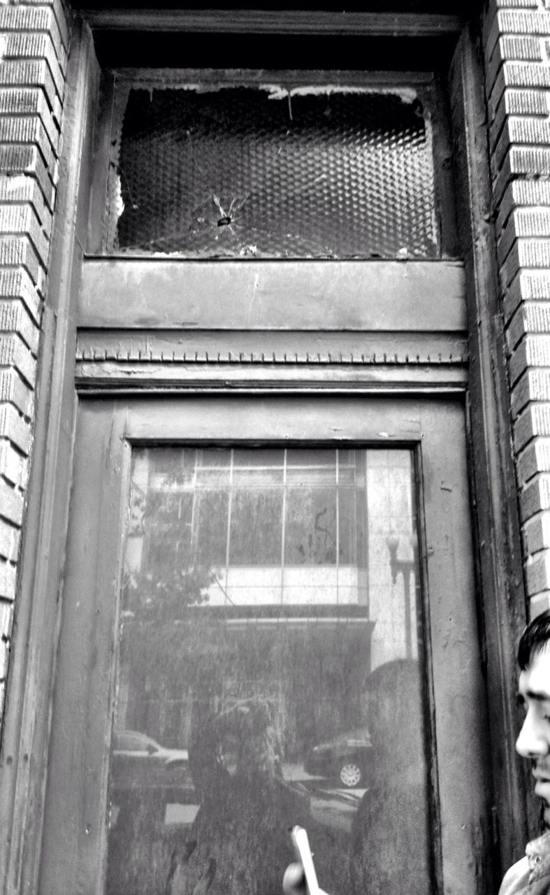 window, architecture, building exterior, built structure, house, door, closed, glass - material, building, low angle view, old, residential structure, residential building, day, open, window sill, brick wall, wall - building feature, doorway, entrance