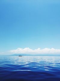 Scenic view of sea against blue sky