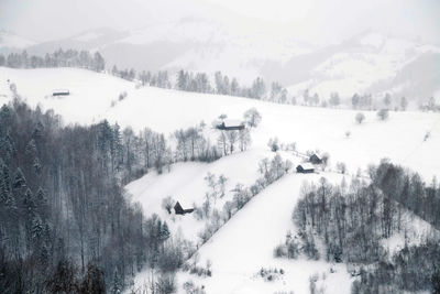 Scenic view of snow covered landscape against sky