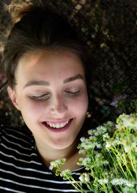 Close-up portrait of a smiling young woman