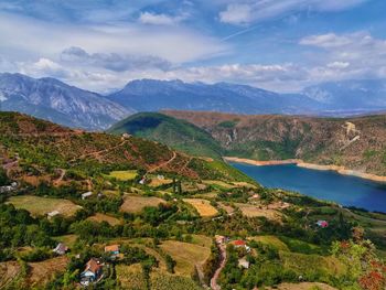 Scenic view of landscape and mountains against sky