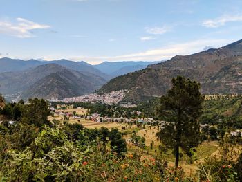 Scenic view of landscape and mountains against sky