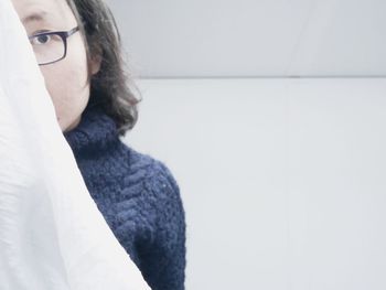 Close-up of woman wearing eyeglasses