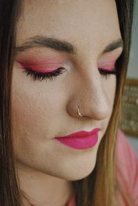 Close-up of beautiful young woman with make-up