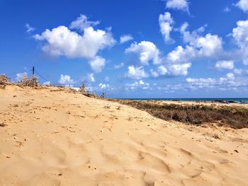 Scenic view of beach against sky