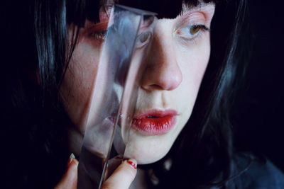 Close-up of woman holding crystal