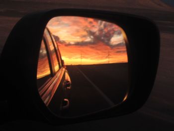 Car on road at sunset