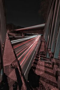 High angle view of light trails on road at night