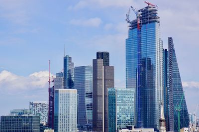 Skyscrapers in city against sky