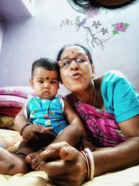 Portrait of happy friends sitting outdoors