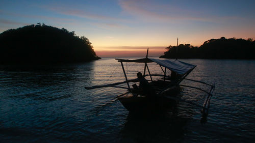 Scenic view of sea at sunset