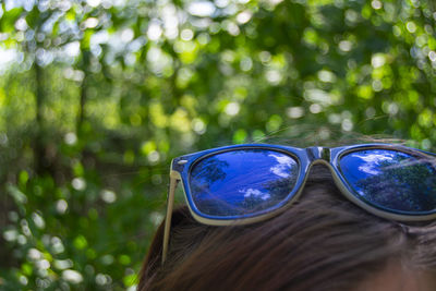 Close-up portrait of woman with sunglasses