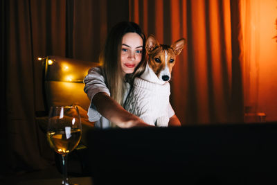 Portrait of young woman at home