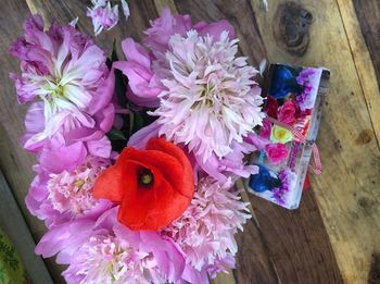 Close-up of flowers on wooden table