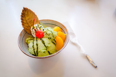 High angle view of fruits in plate on table