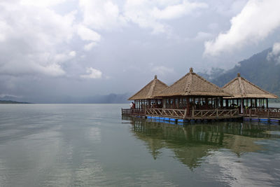 House by sea against sky
