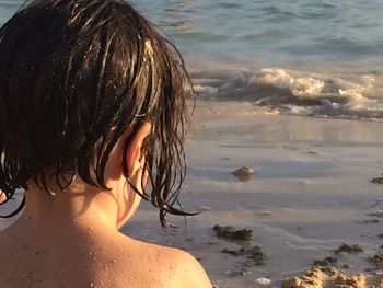 Rear view of woman on beach