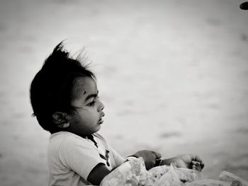 Close-up of baby boy at beach