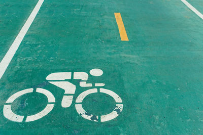 High angle view of sign on road