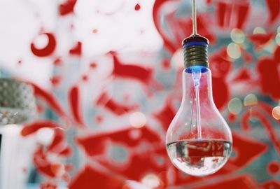 Close-up of light bulb hanging