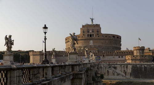 Bridge and castle against clear sky