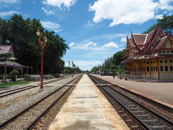 View of railroad tracks against cloudy sky