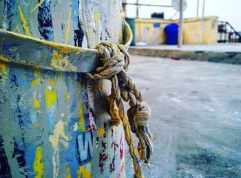 Close-up of rope tied to pole